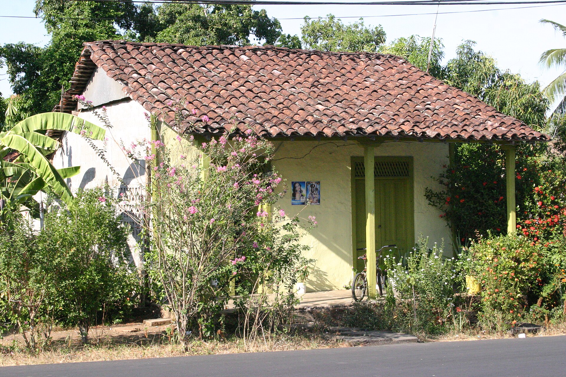 A rural house with a clay-tile roof in Pesé, Herrera province, Panama