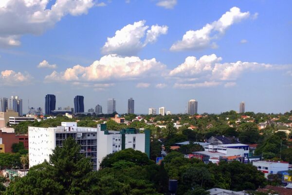 Skyline and tower blocks of Asunción, the capital of Paraguay, under a blue sky