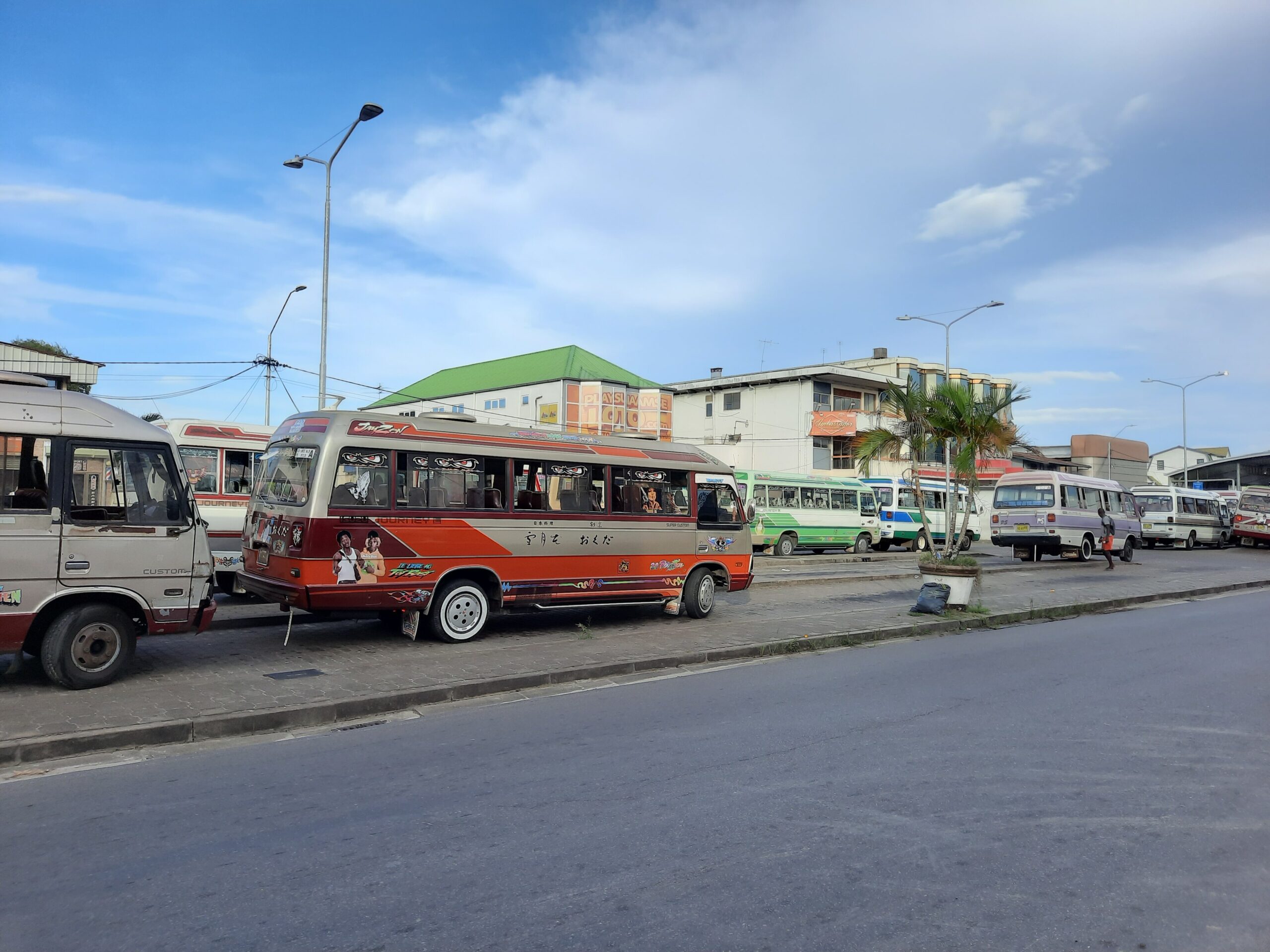 Privately run minibuses at a bus stand in Paramaribo, Suriname