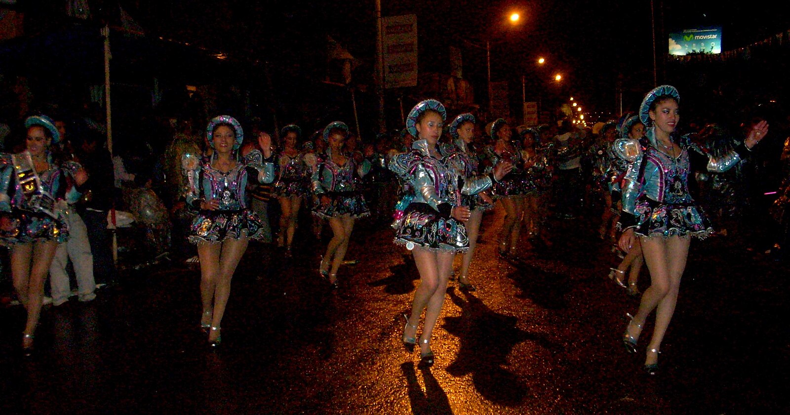 caporales dancers parade at night through the streets of Puno
