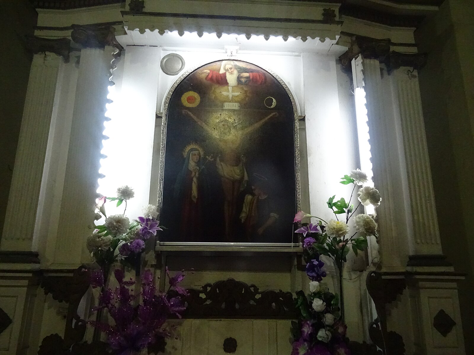 an image of the Señor de los Milagros on a church altar in Lima