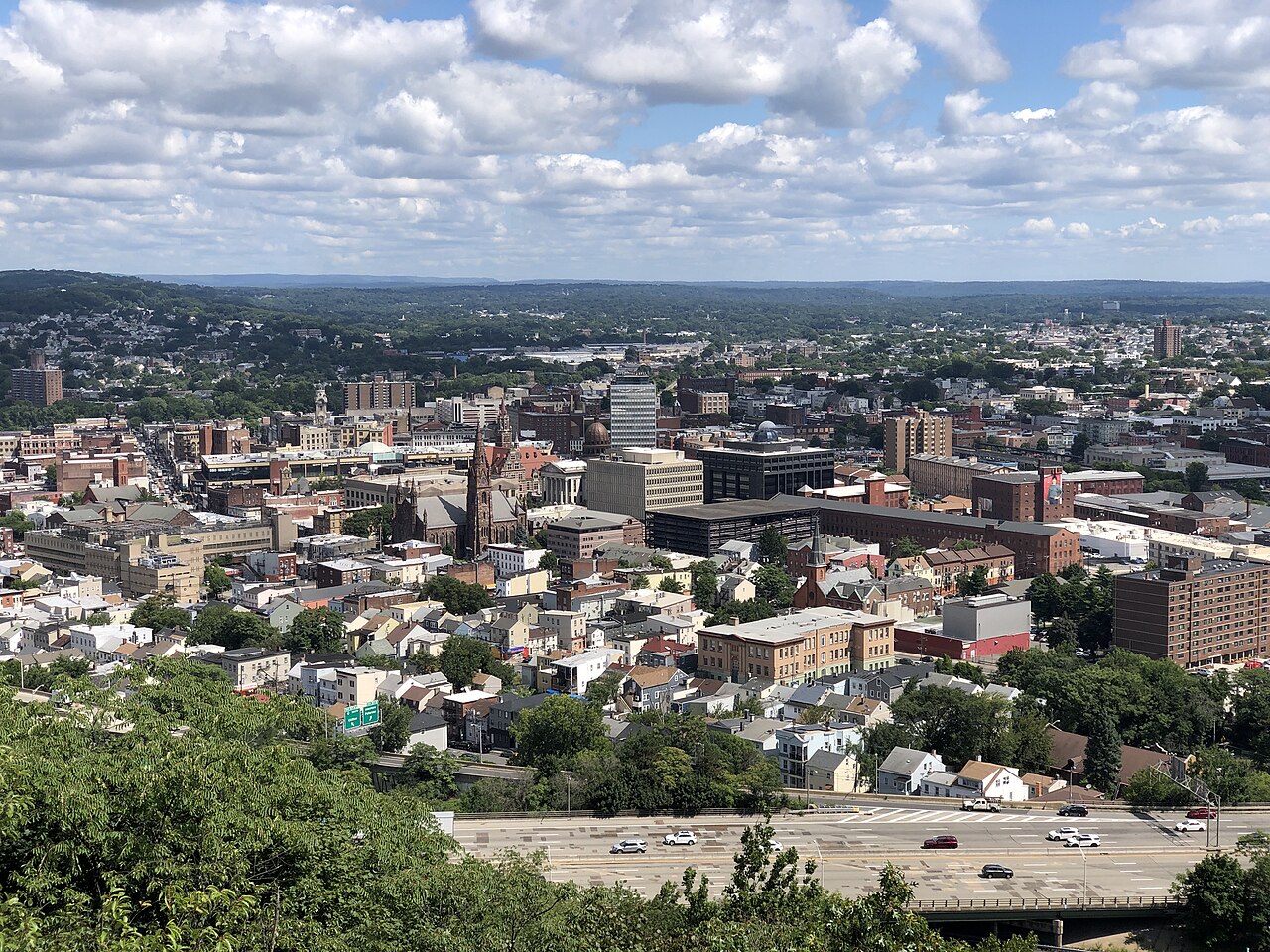 Rooftops, church spires and a highway in downtown Paterson, New Jersey