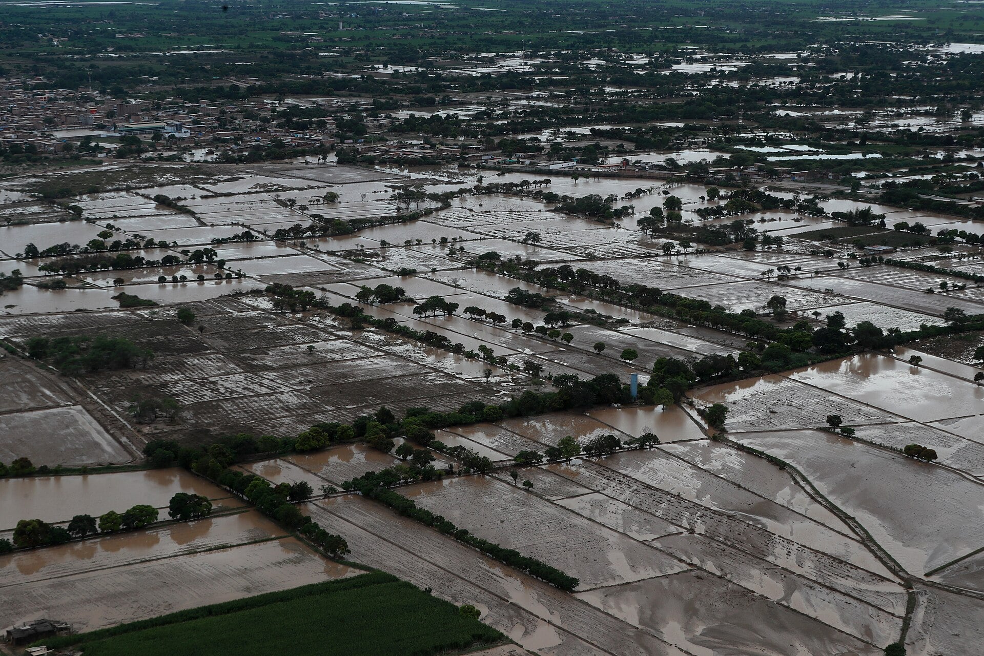 Aerial view of flooded farmland and a town in northern Peru during heavy rains in March 2023