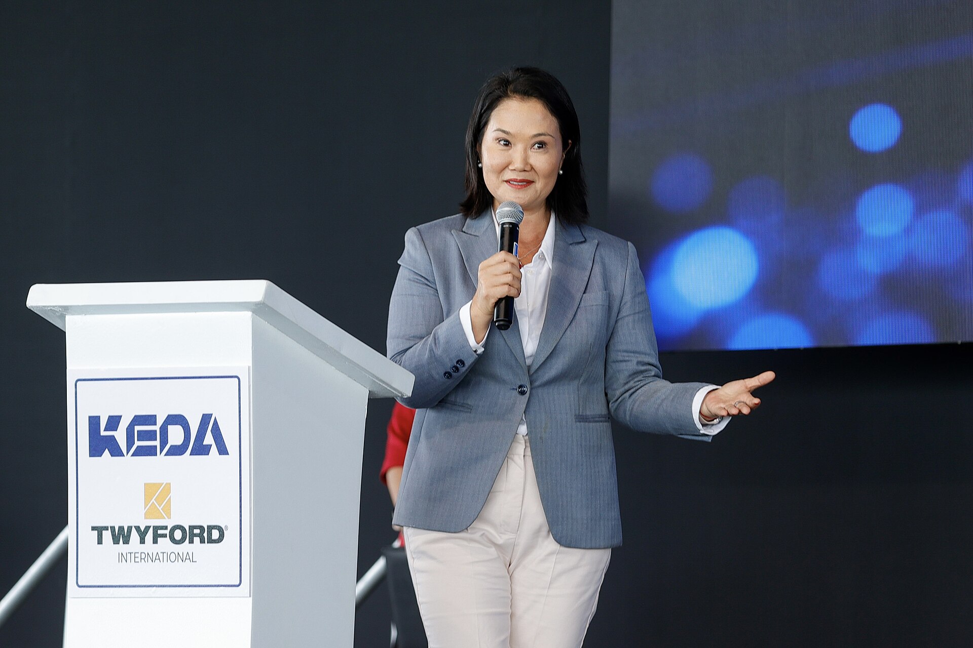Keiko Fujimori speaking at a podium at a public event