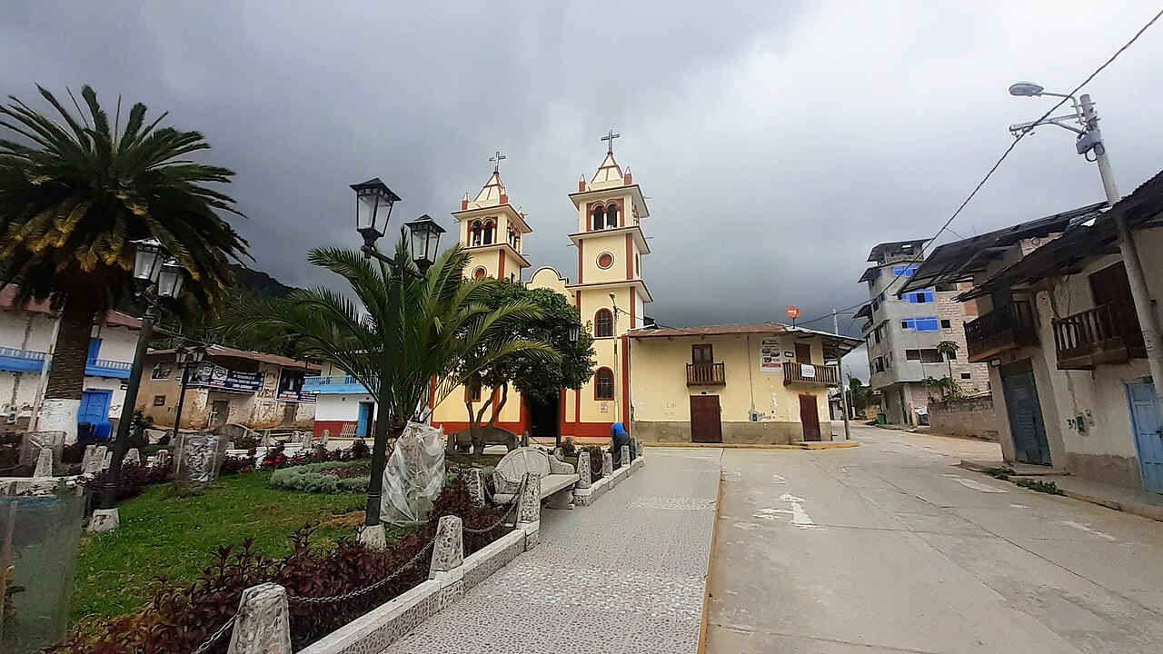 The main square and twin-towered church of Chugur, a small Andean town in Hualgayoc province, Cajamarca, Peru, under a cloudy sky