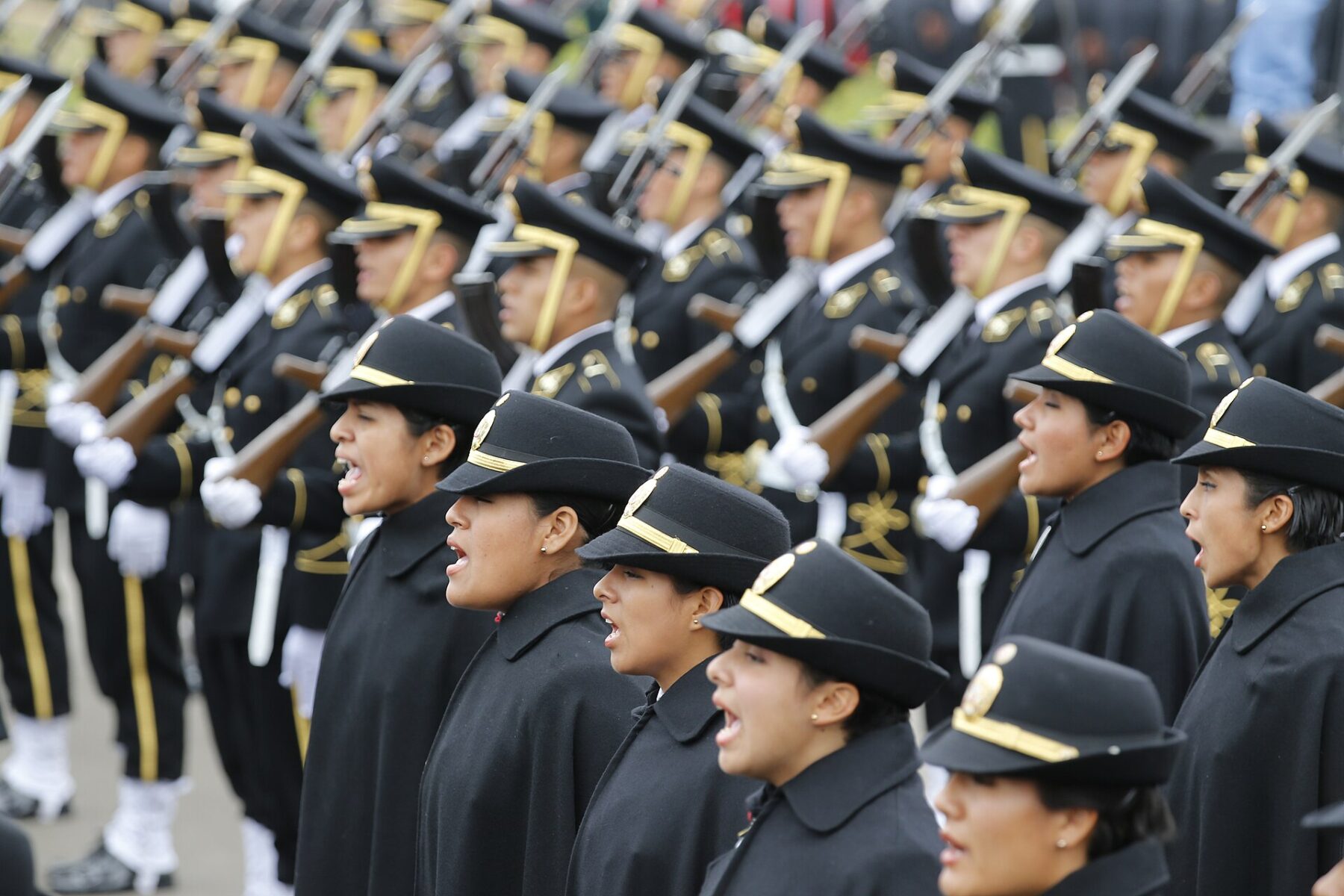Peruvian National Police officer cadets in dress uniform at a ceremony in Chorrillos, Lima