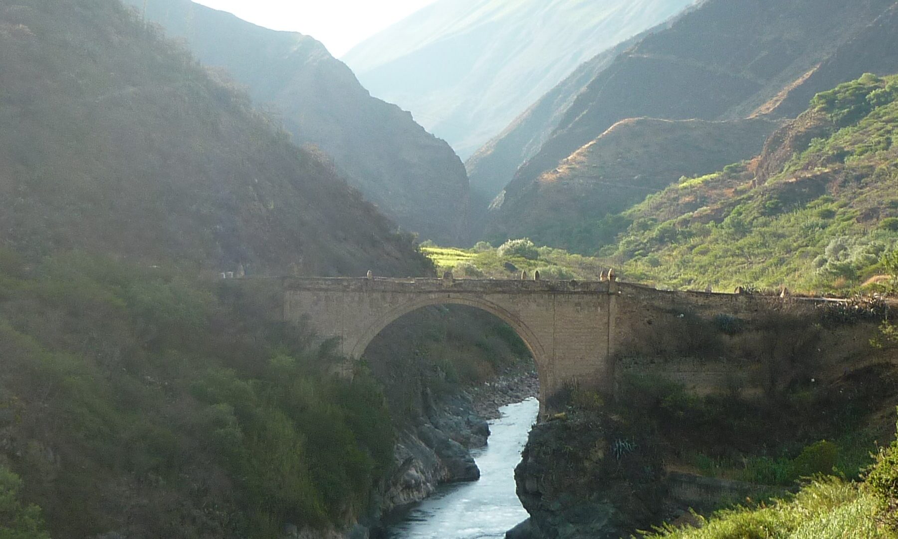 Colonial stone bridge over the Pachachaca River in the Andes of Apurímac, Peru