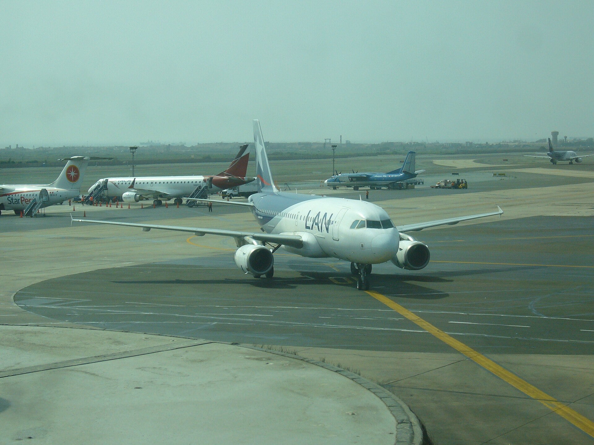 A LAN Airbus taxiing past other airliners at Jorge Chávez International Airport in Lima