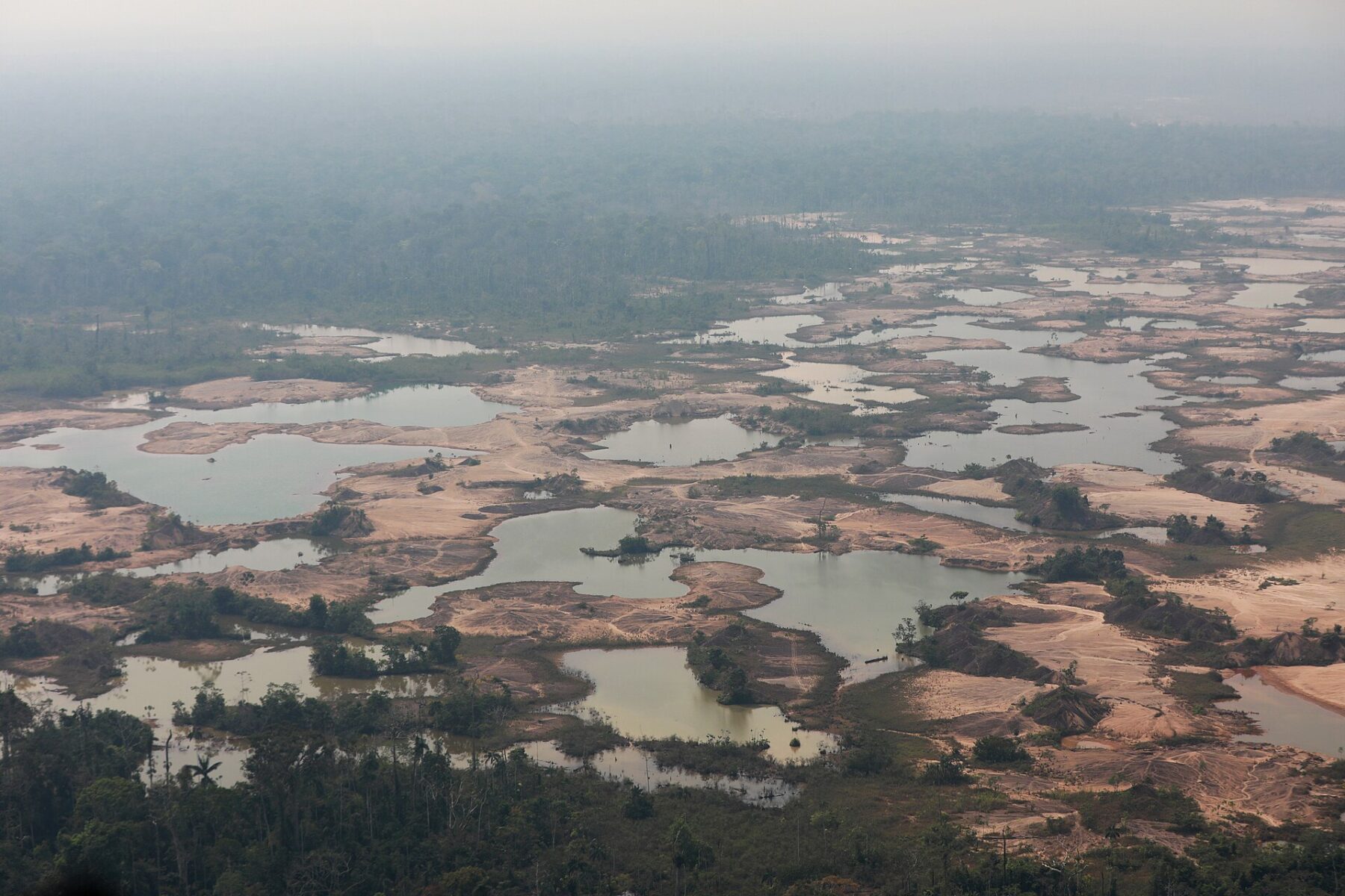 Aerial view of land stripped by illegal gold mining in La Pampa, Madre de Dios, Peru