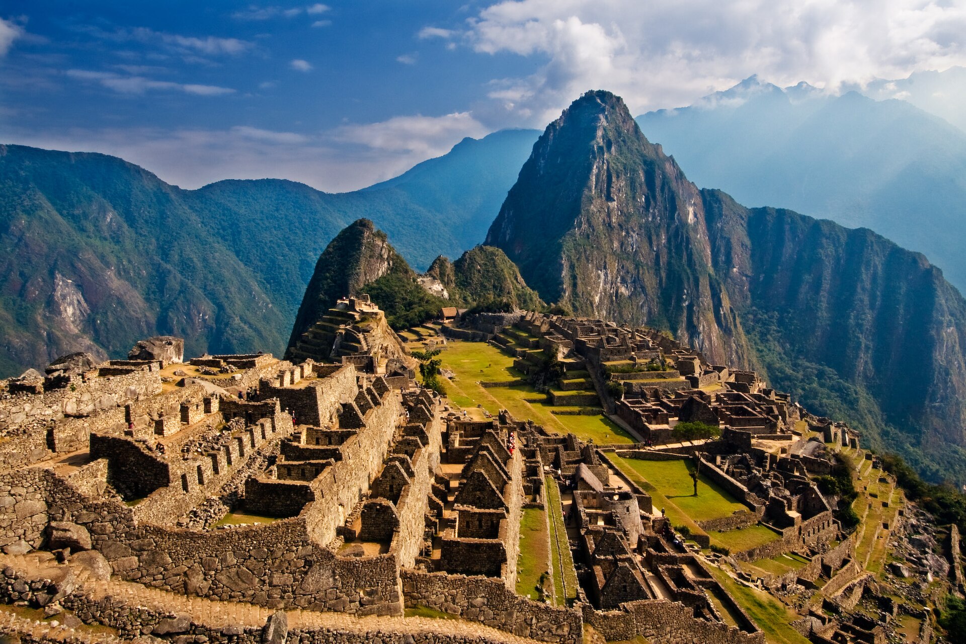 Inca ruins of Machu Picchu with the peak of Huayna Picchu behind, in the Cusco region of Peru