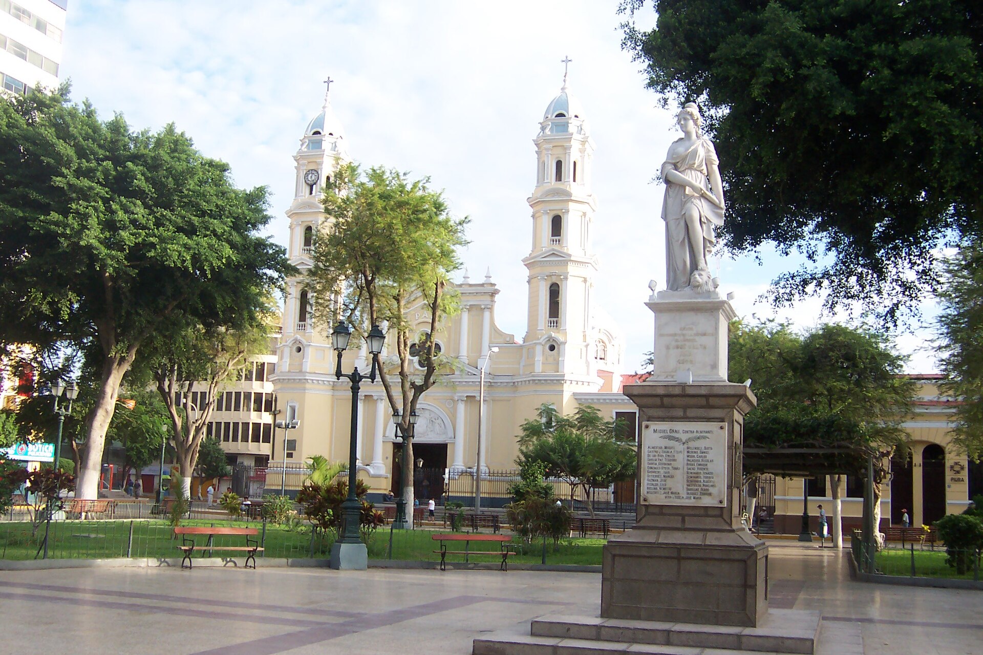 The cathedral and a statue of Miguel Grau in the Plaza de Armas of Piura, Peru