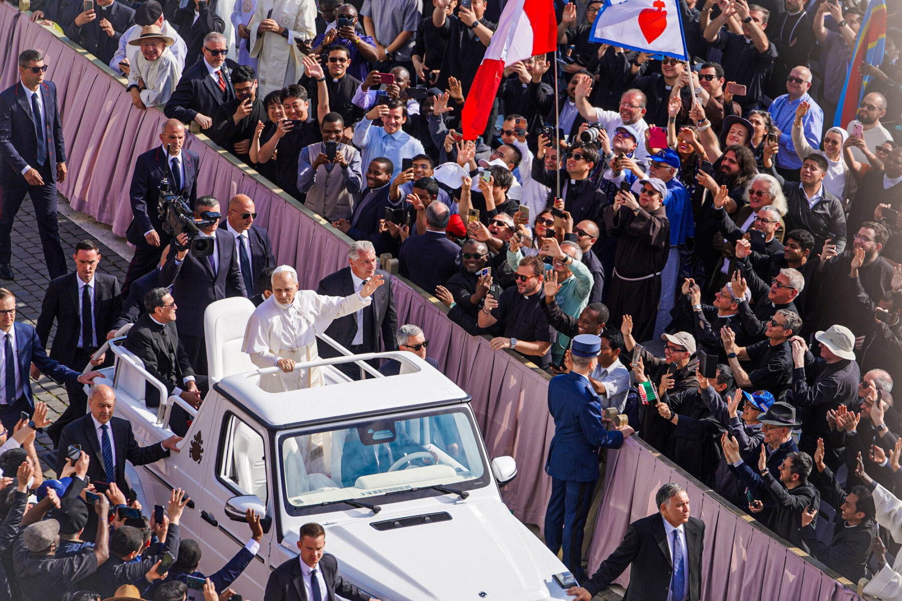 Pope Leo XIV waving to faithful in St Peter's Square at the Vatican