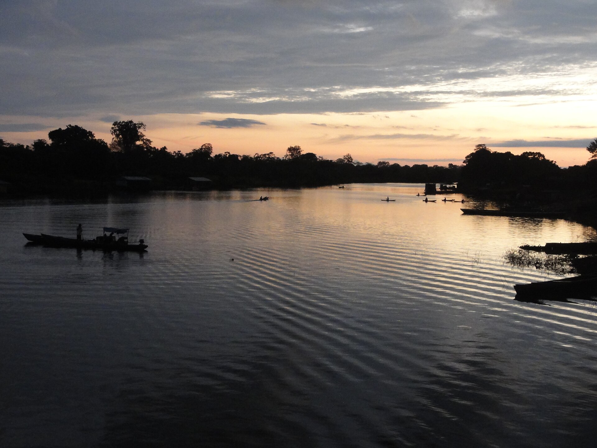 Boats on Lake Caballococha at dusk in Peru's Amazon near the borders with Colombia and Brazil