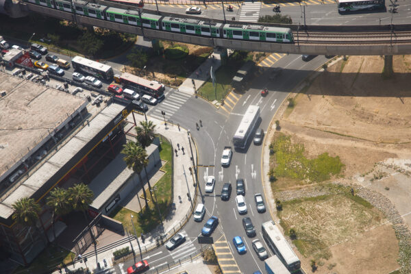 Aerial view of a Lima junction beside Metro Line 1 with a military truck parked by the road