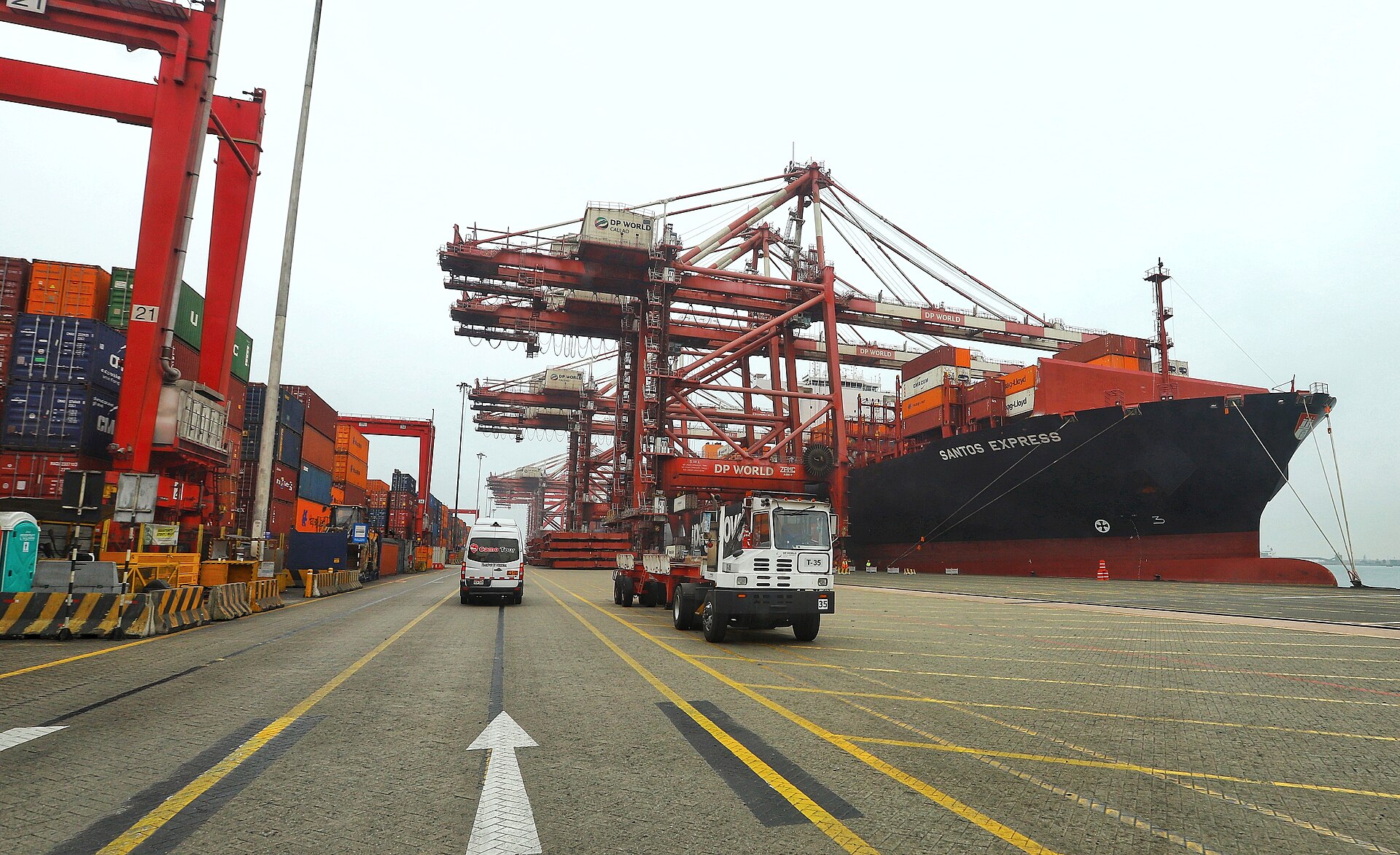 Container terminal at the port of Callao, Peru, with stacked containers and cranes beside the bay