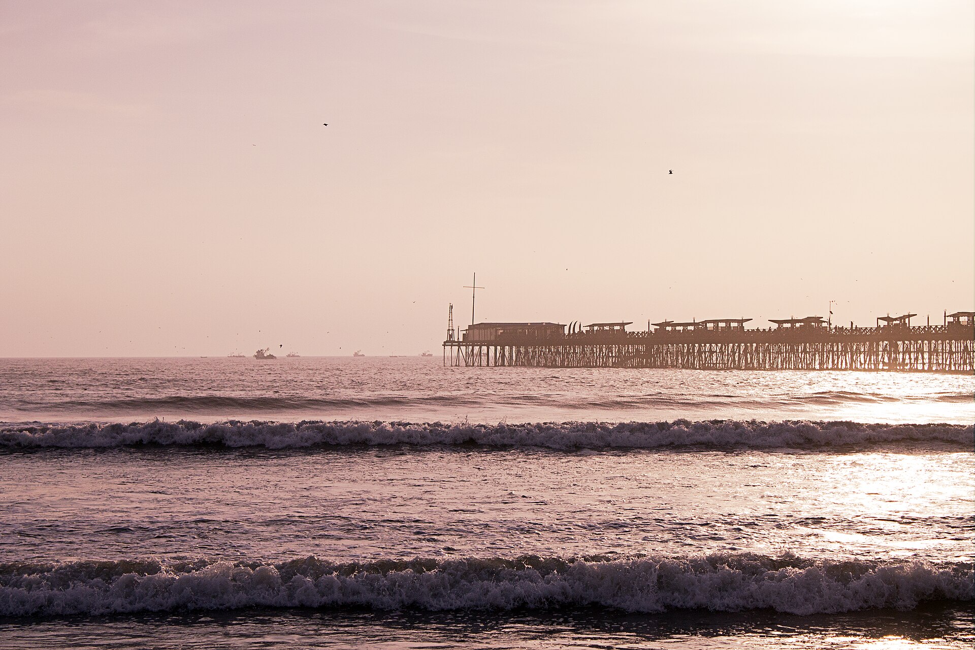 The pier at Pimentel beach near Chiclayo, Peru, at sunset