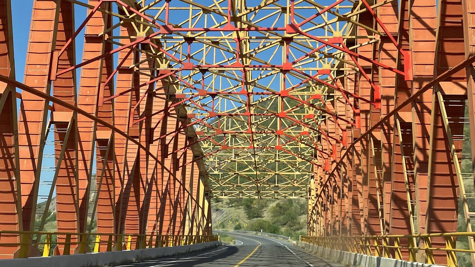 Orange and yellow truss bridge on the Siglo XXI toll motorway over the Balsas River at the Michoacan-Guerrero border, Mexico