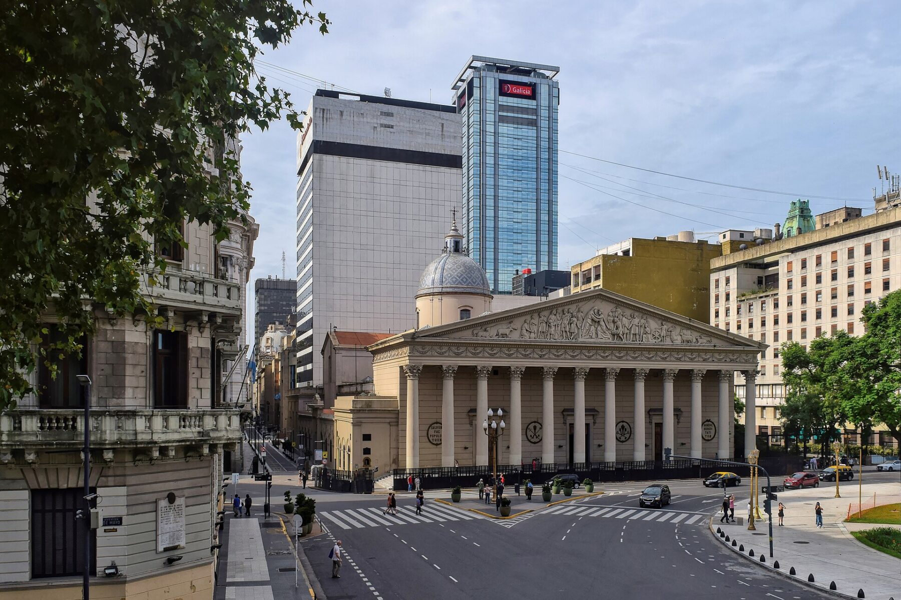 The neoclassical facade of the Metropolitan Cathedral of Buenos Aires with office towers behind it
