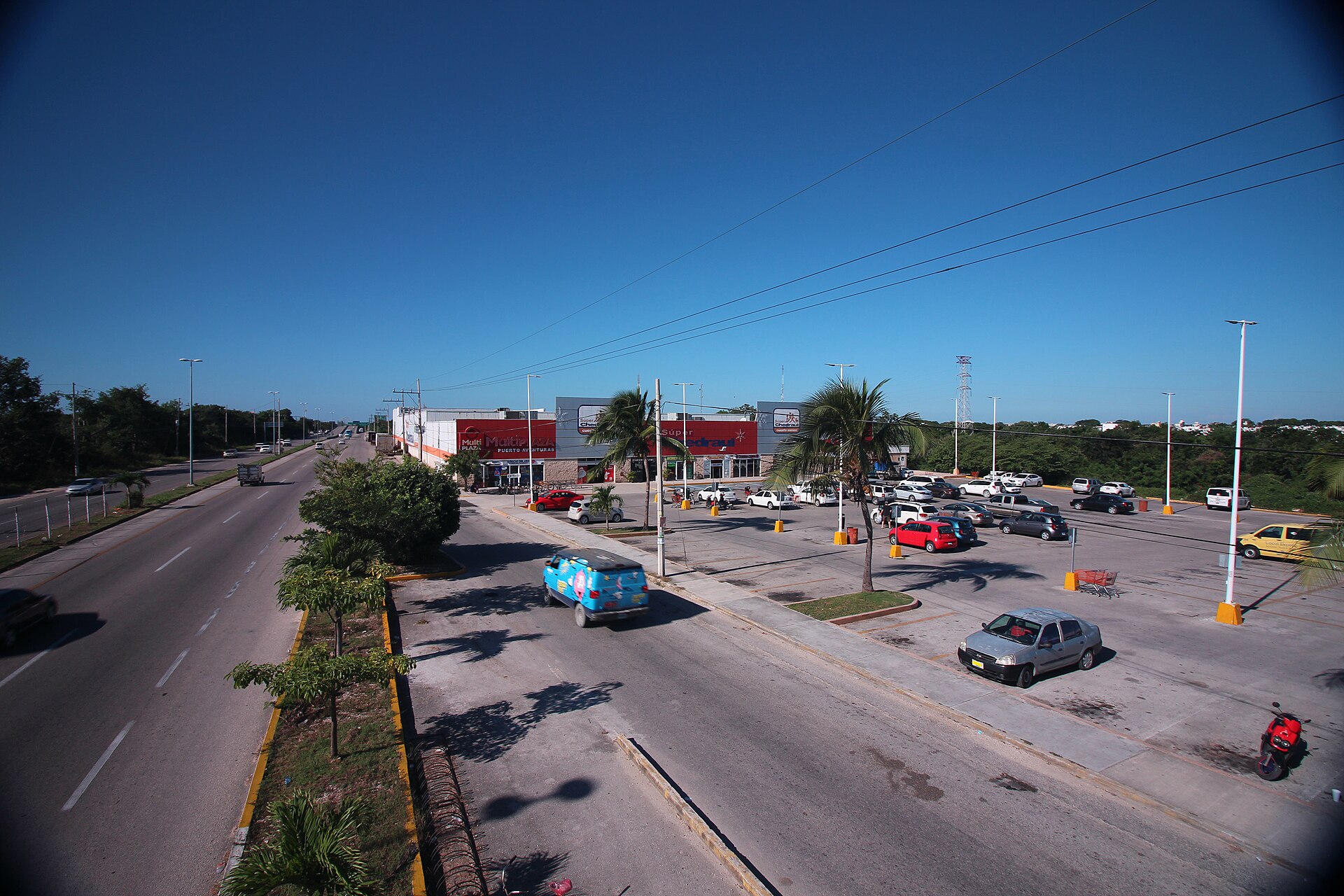 View over Federal Highway 307 and a shopping plaza near Puerto Aventuras, Quintana Roo, from a pedestrian viaduct