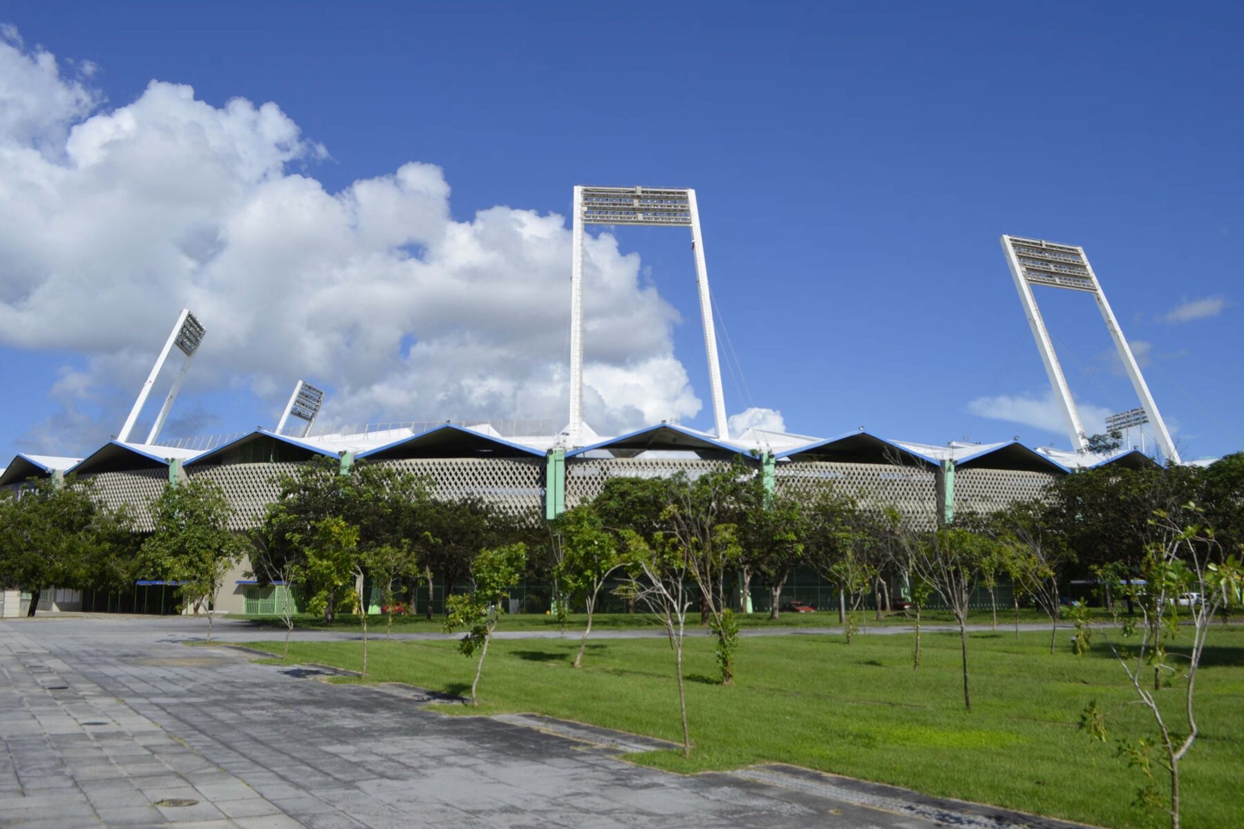 Hiram Bithorn Stadium with its floodlight towers under a blue sky in San Juan, Puerto Rico