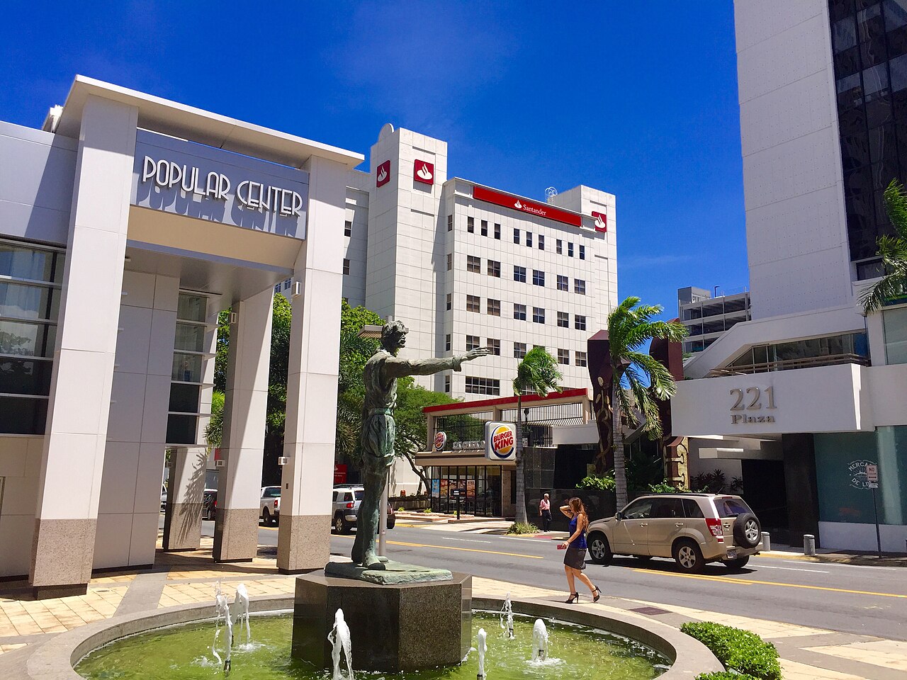 Entrance of the Popular Center office complex in San Juan with a bronze statue and fountain in the foreground