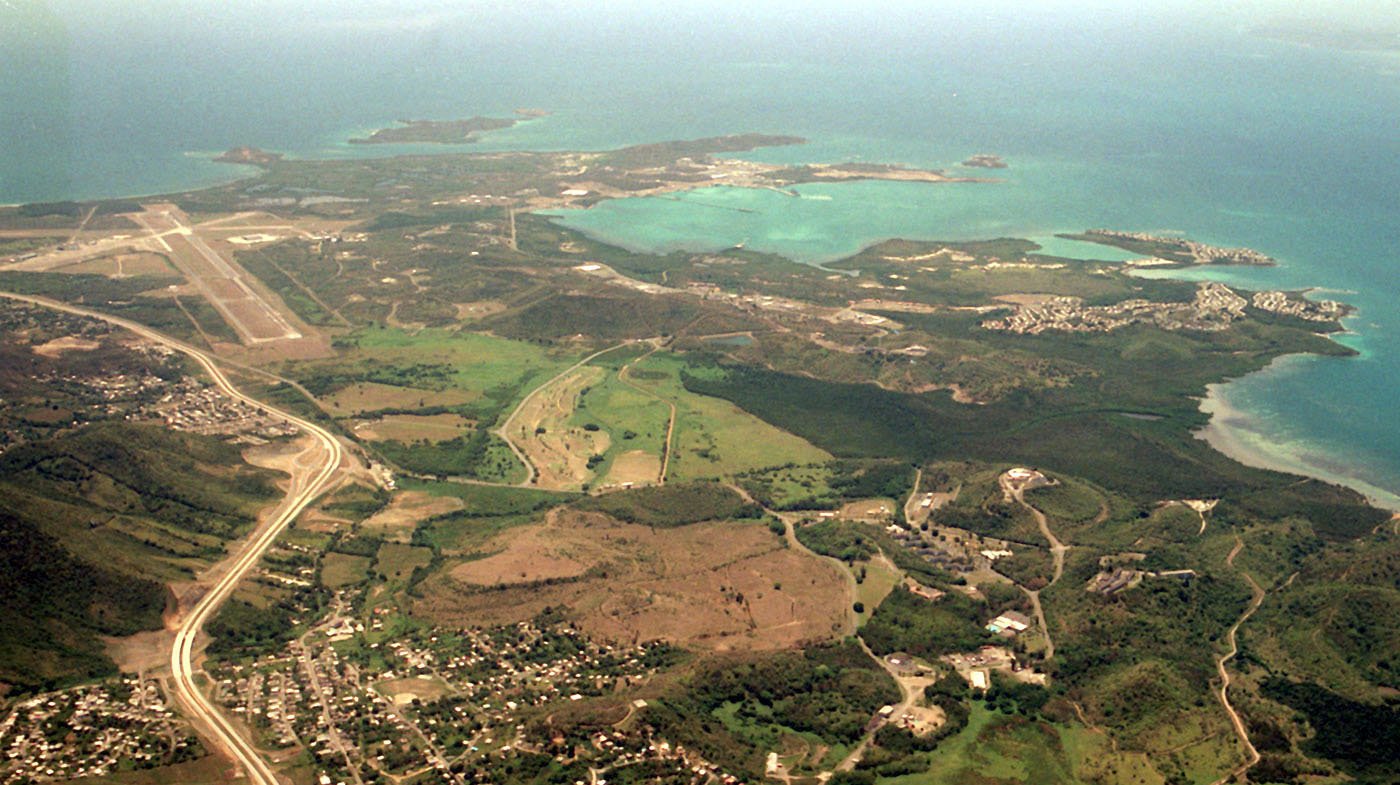 Aerial view of the airfield, bays and green hills of the former Naval Station Roosevelt Roads in Ceiba, Puerto Rico