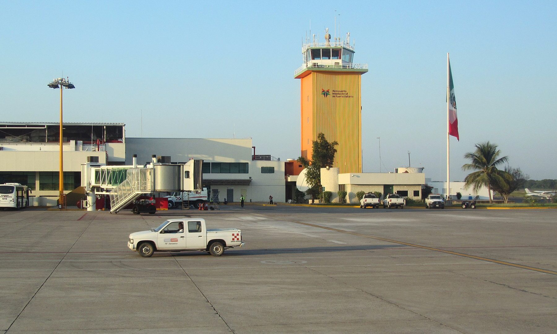 Control tower and terminal of Puerto Vallarta International Airport seen from the apron