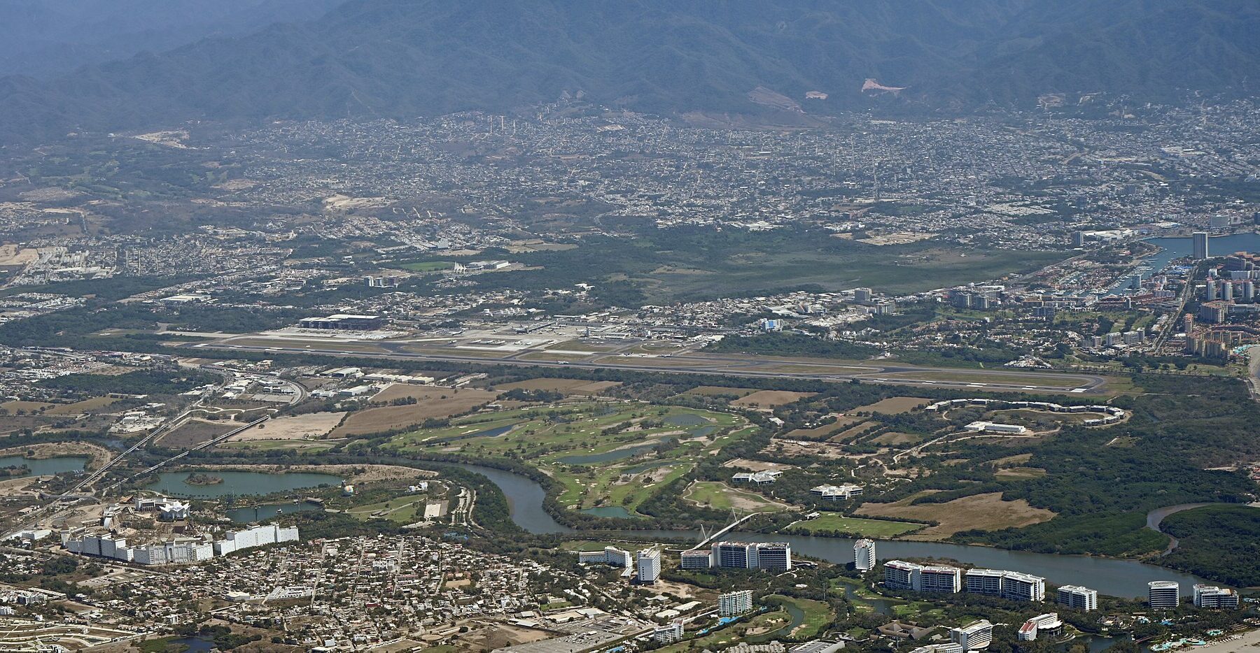 Aerial view of Puerto Vallarta airport, the coast and hotels
