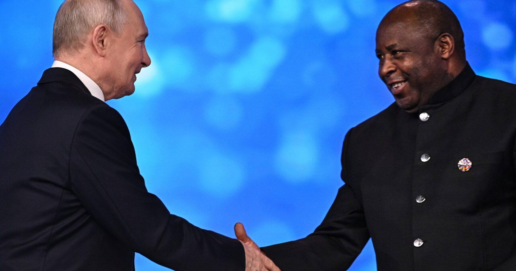 Vladimir Putin shakes hands with African Union chairperson Evariste Ndayishimiye at the Russia-Africa forum in Moscow