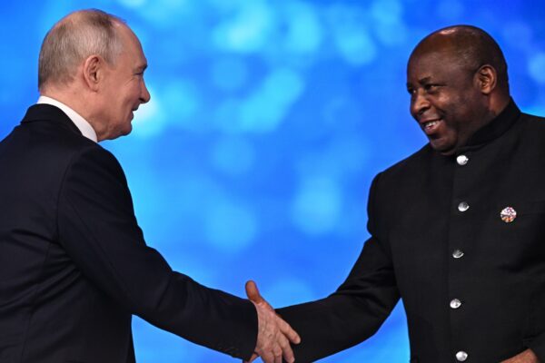 Vladimir Putin shakes hands with African Union chairperson Evariste Ndayishimiye at the Russia-Africa forum in Moscow