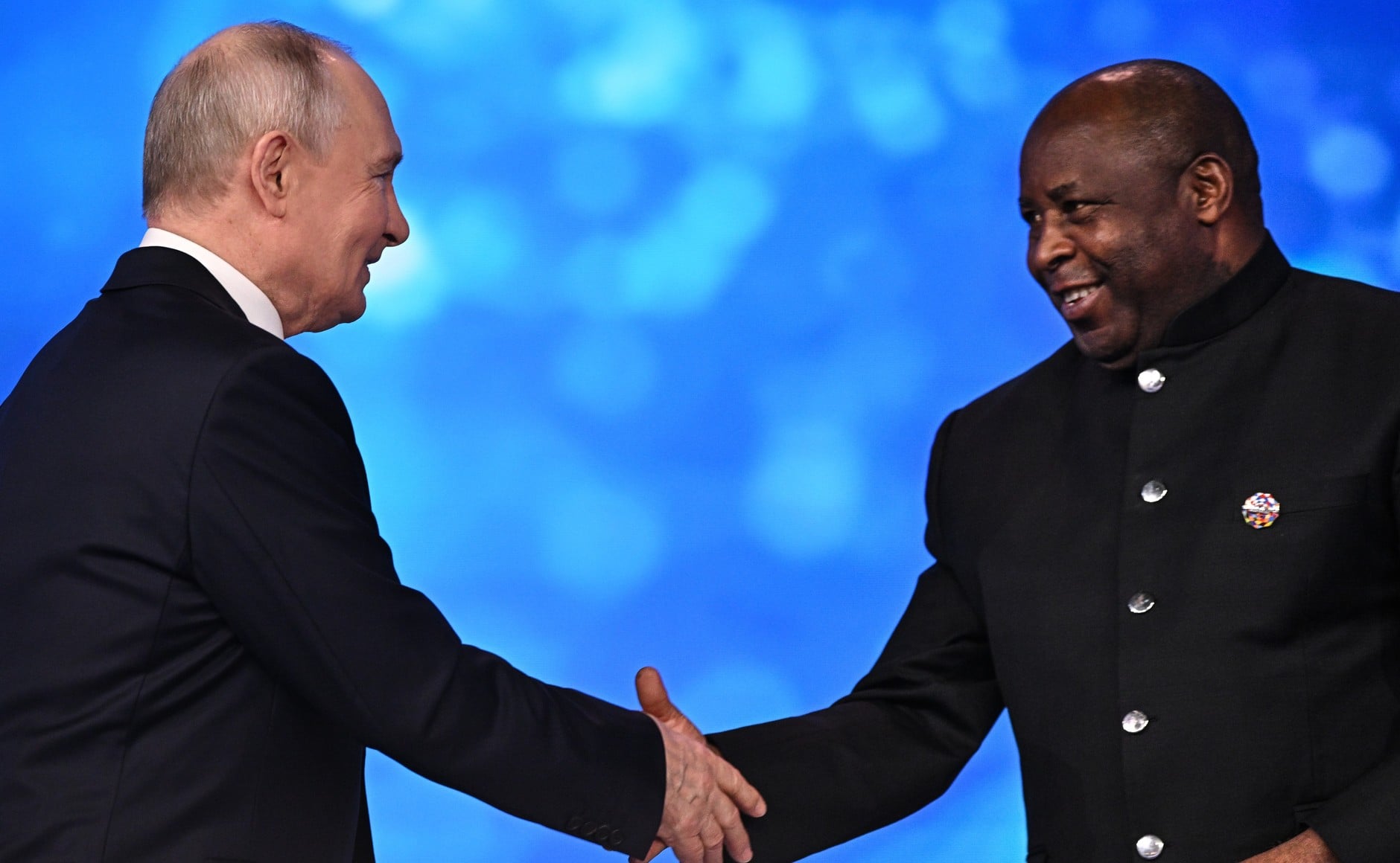 Vladimir Putin shakes hands with African Union chairperson Evariste Ndayishimiye at the Russia-Africa forum in Moscow
