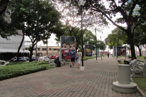 A tree-lined promenade with street art panels on Independence Square in Port of Spain, Trinidad and Tobago