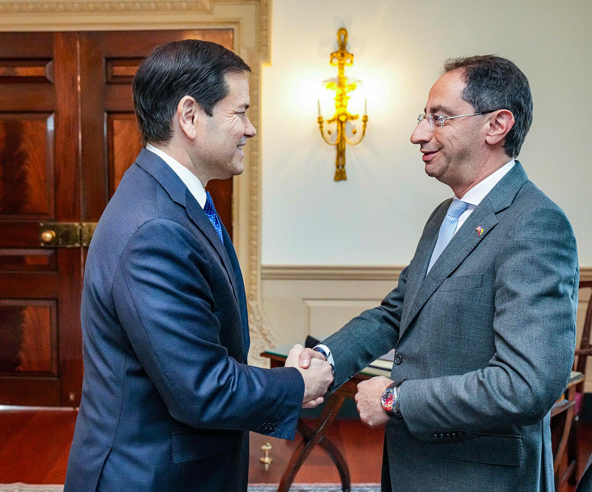 US Secretary of State Marco Rubio shakes hands with José Manuel Restrepo at the State Department