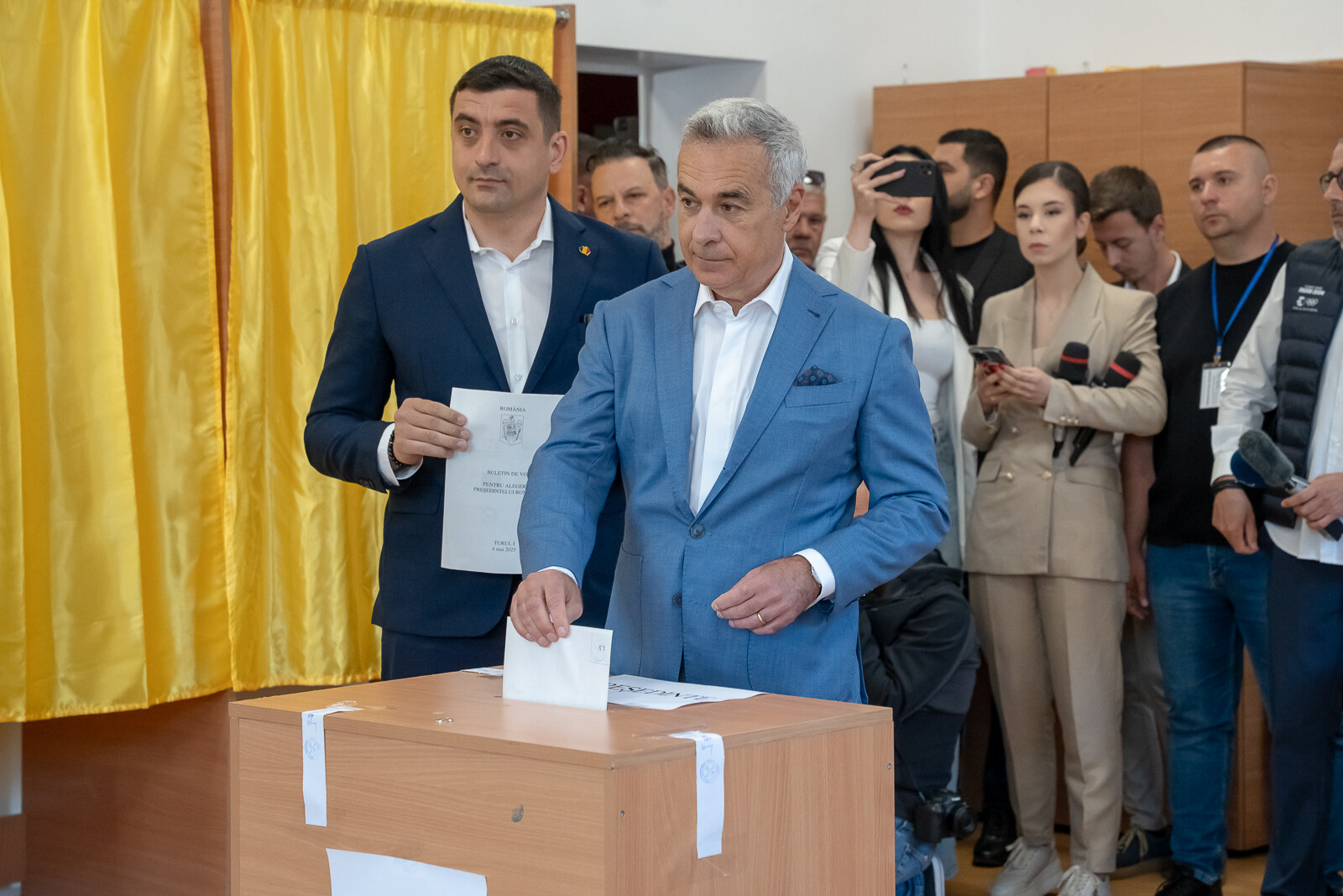 George Simion and Calin Georgescu side by side on the day of the first round of Romania's 2025 presidential rerun