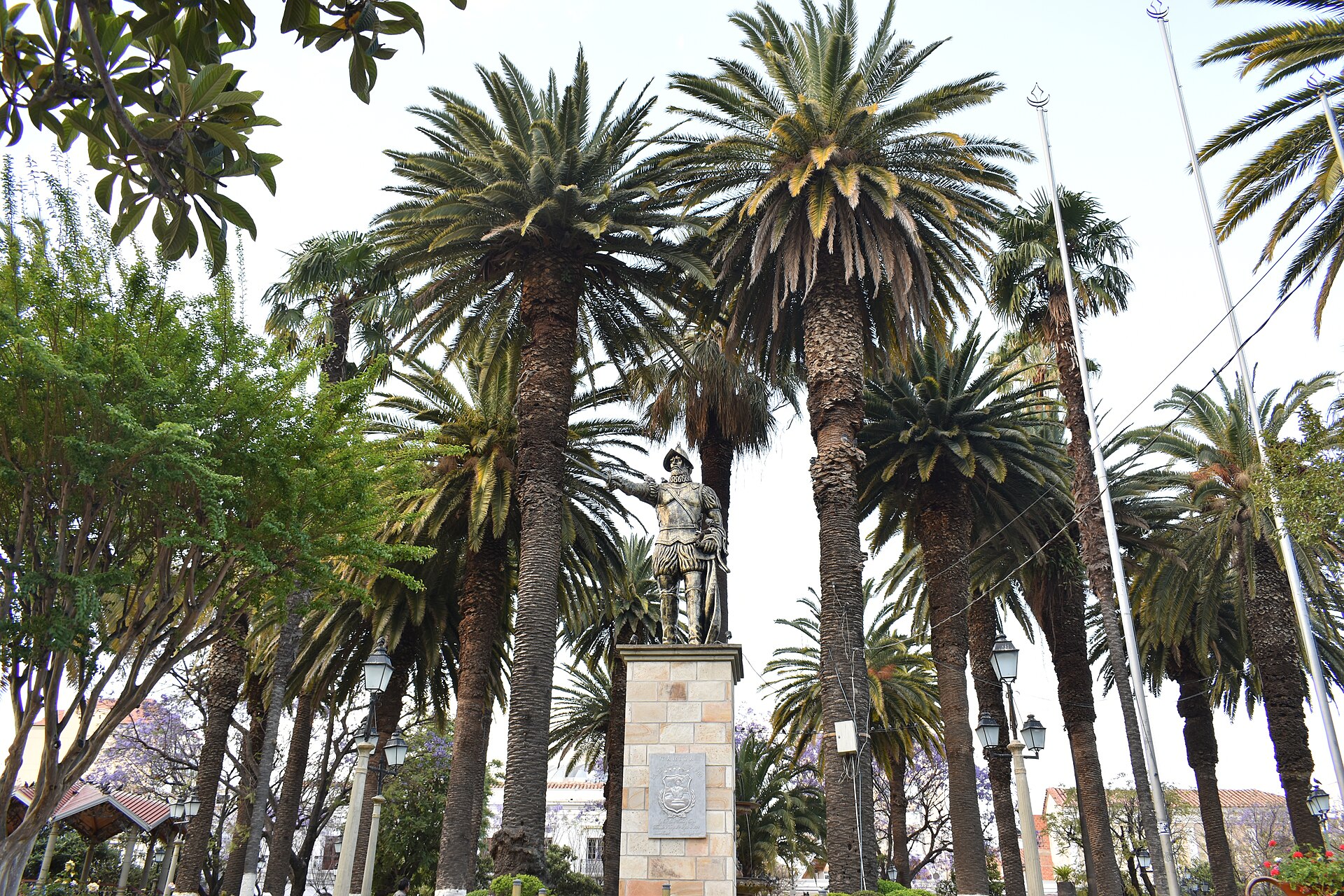 Statue of Luis de Fuentes y Vargas, founder of Tarija, among palm trees on the main plaza of Tarija, southern Bolivia