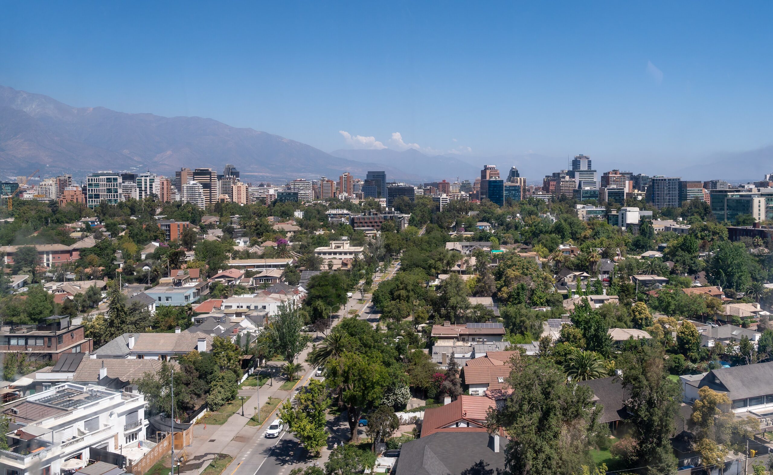 Rooftops and office towers of Santiago, Chile, with the Andes behind