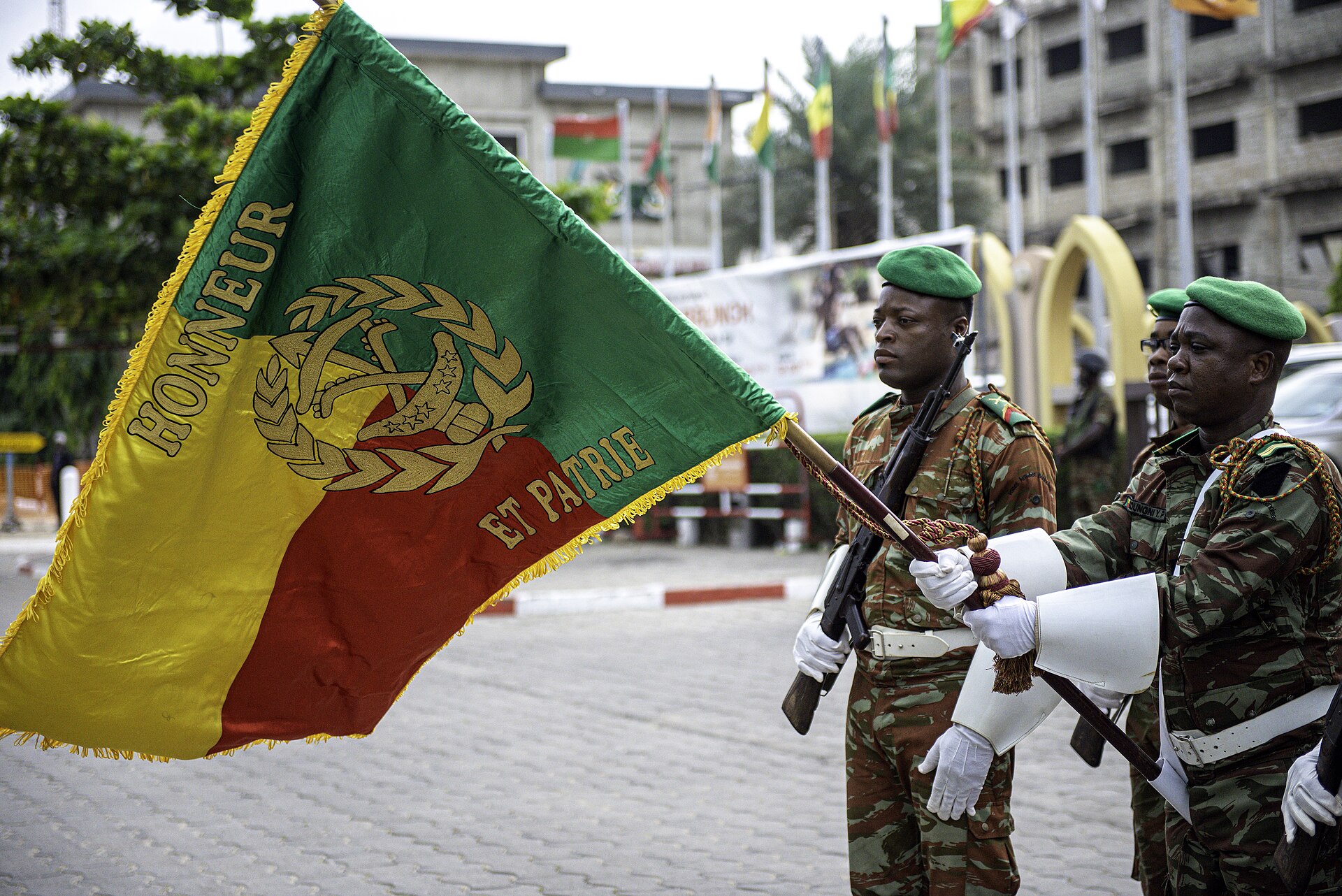 Beninese soldiers carry the national military flag in Cotonou during Africa Endeavor 2025