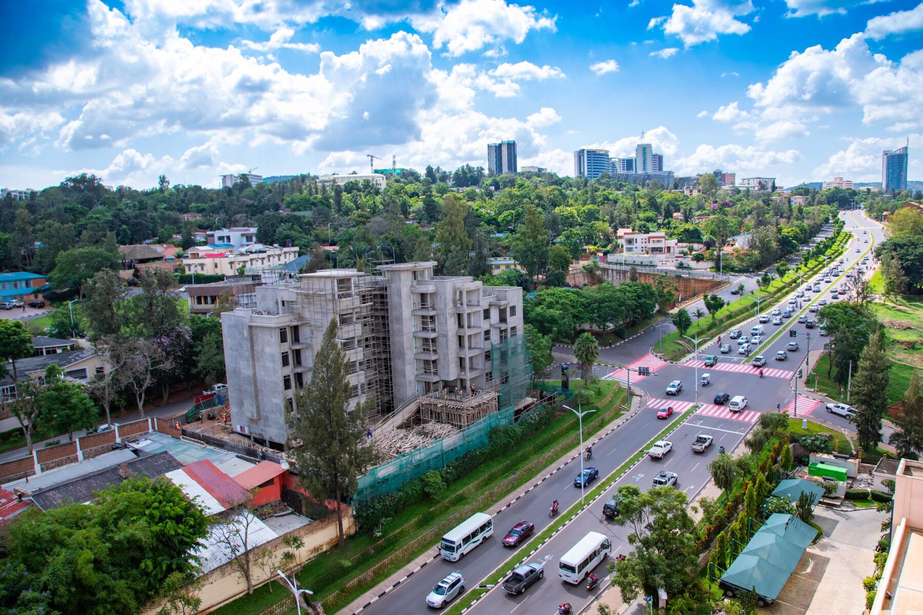 High-angle view of a main road with traffic and buildings in Kigali, Rwanda