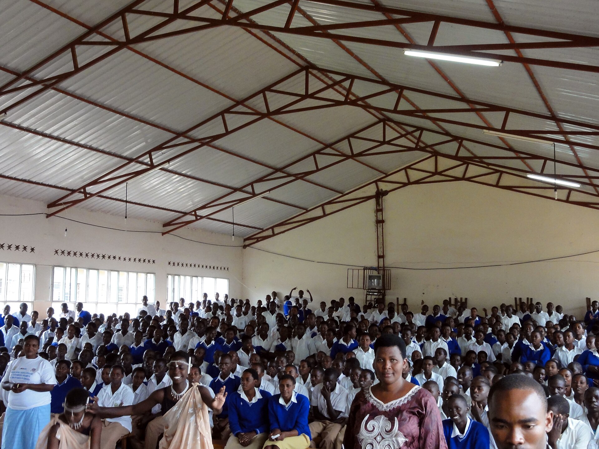 Pupils in blue and white uniforms fill the assembly hall of the Rilima school complex in Rwanda's Eastern Province