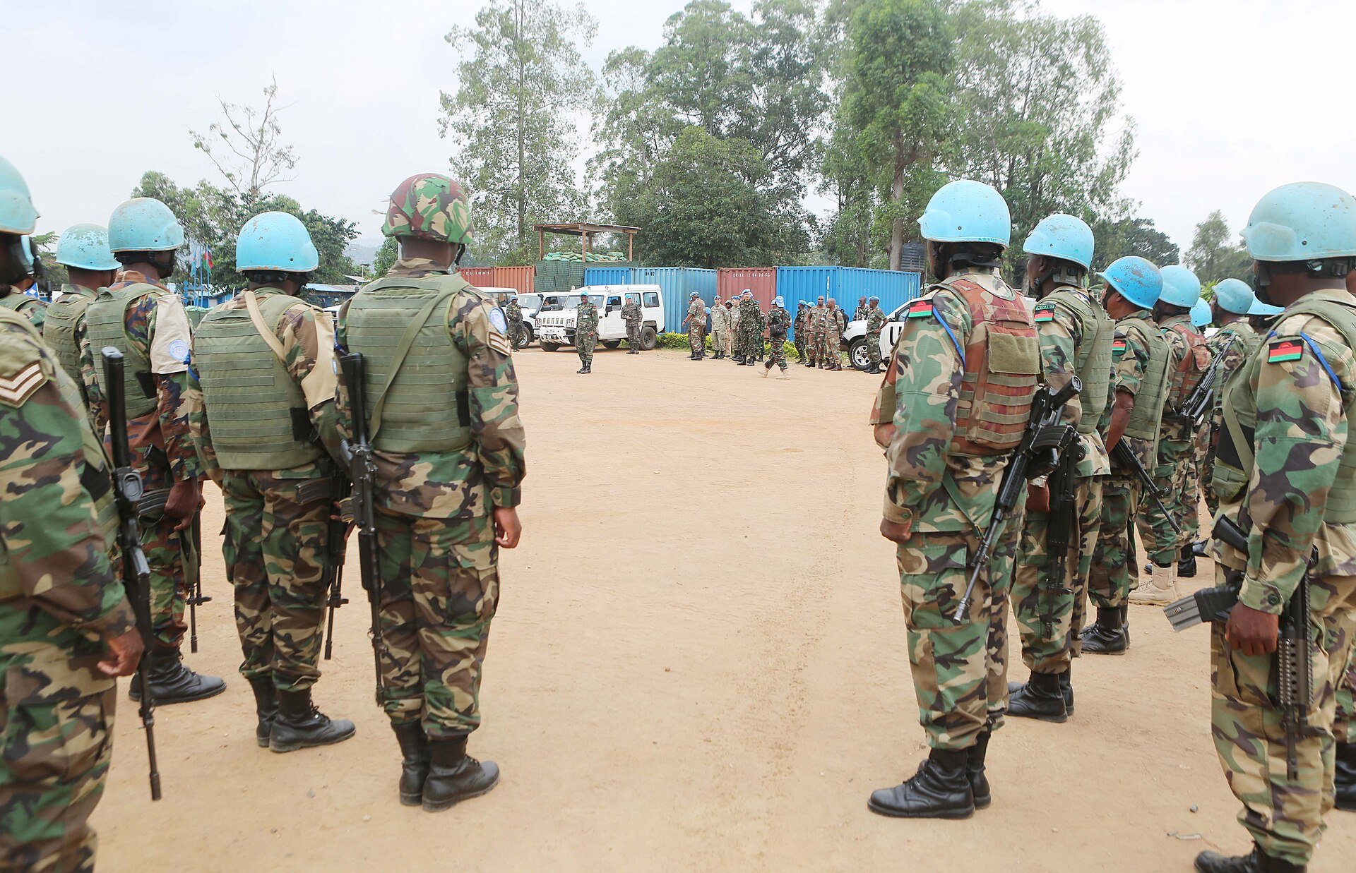 Malawian soldiers in blue UN helmets standing in two lines at a base in Beni, eastern DR Congo