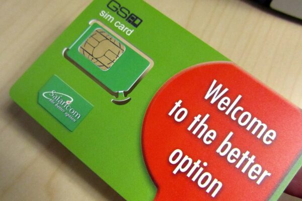 A green Safaricom SIM card held in a hand, with the words Welcome to the better option