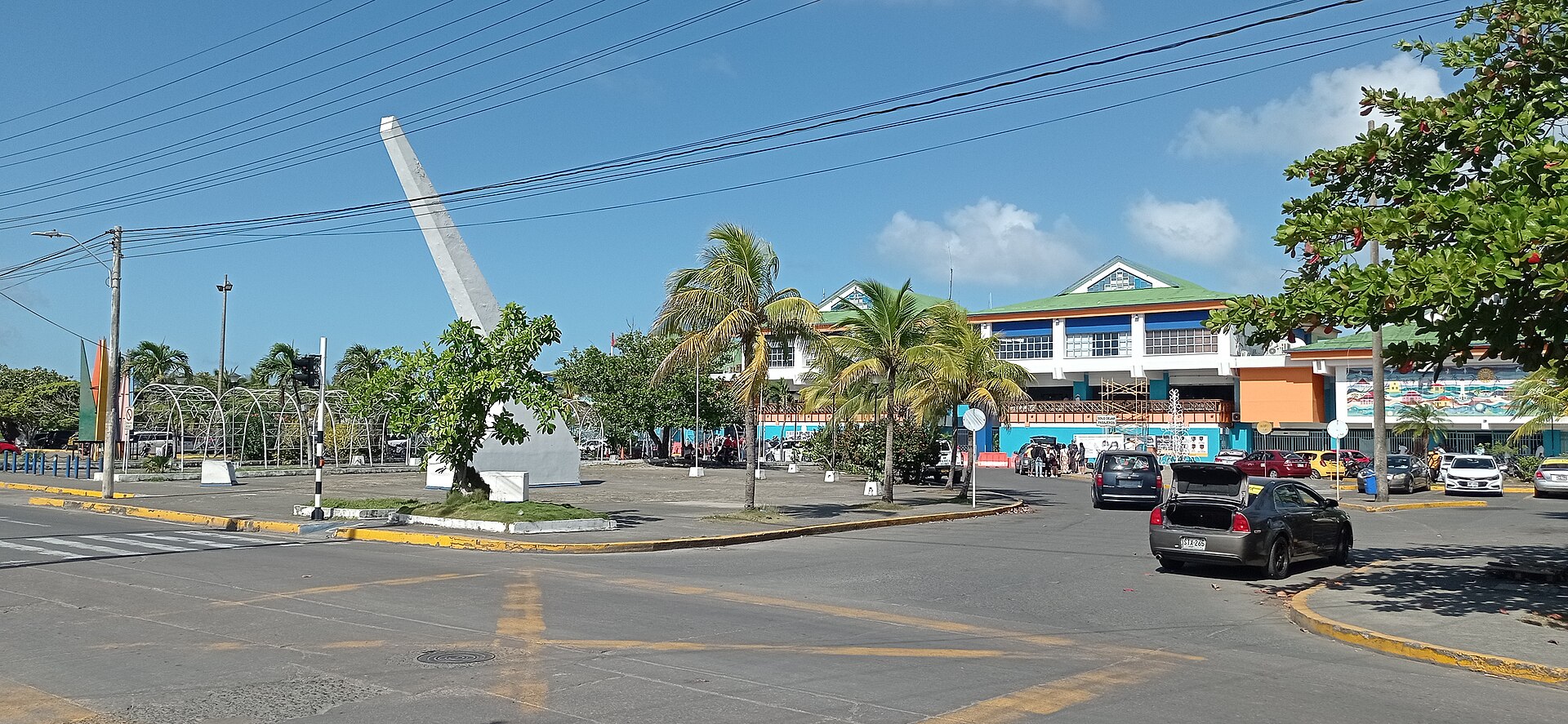 San Andrés airport terminal in Colombia with the white Navy veterans monument in front