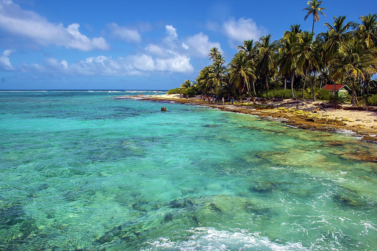 Turquoise reef water and palm trees on Johnny Cay off San Andrés island, Colombia