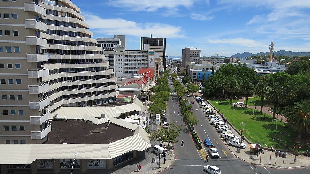 Downtown Windhoek, Namibia, with office towers, a tree-lined avenue and a park