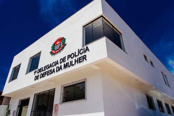 White building of a women's police station in Campinas, São Paulo state, with the state police crest