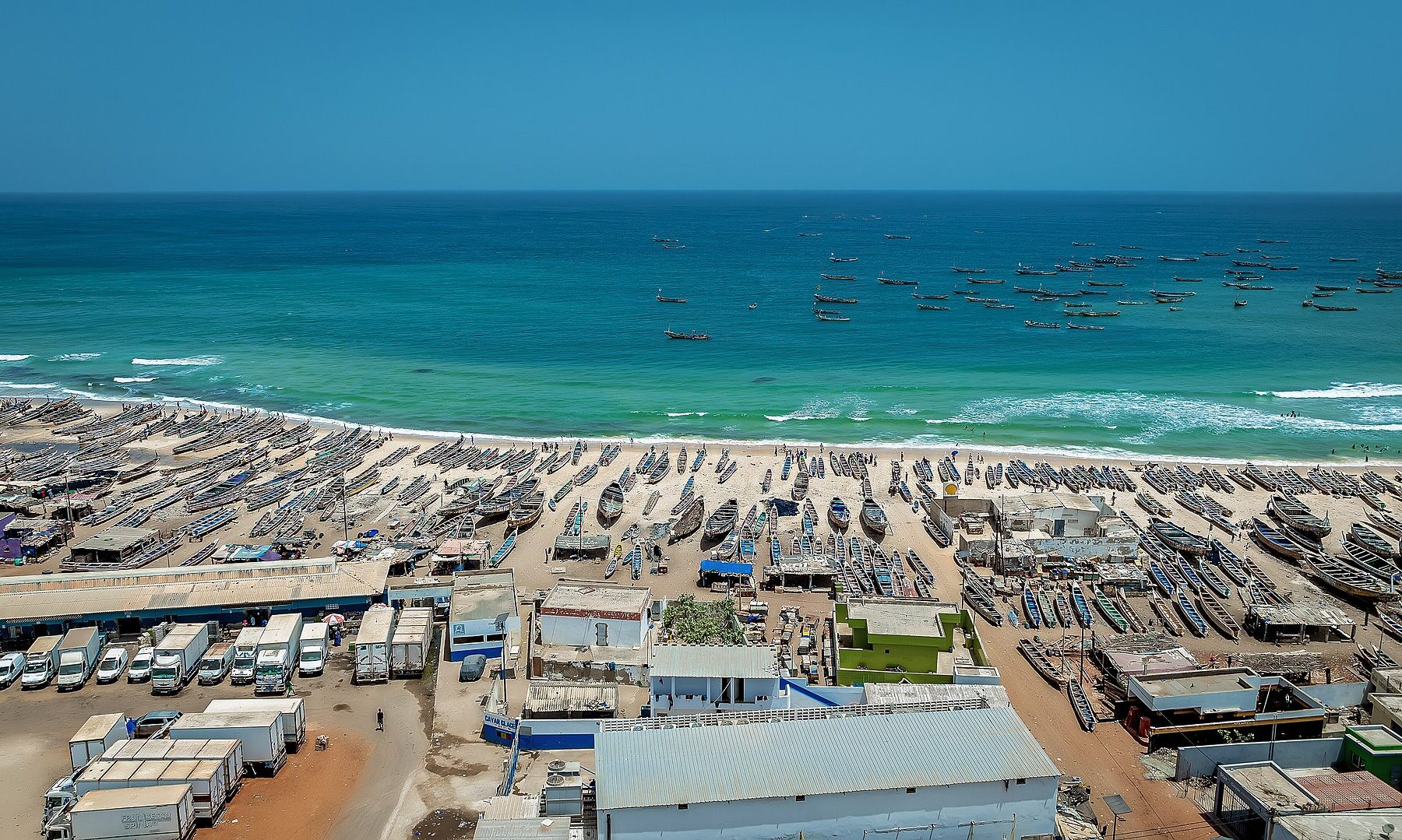 Fishing pirogues on the beach at Kayar, Senegal, seen from above
