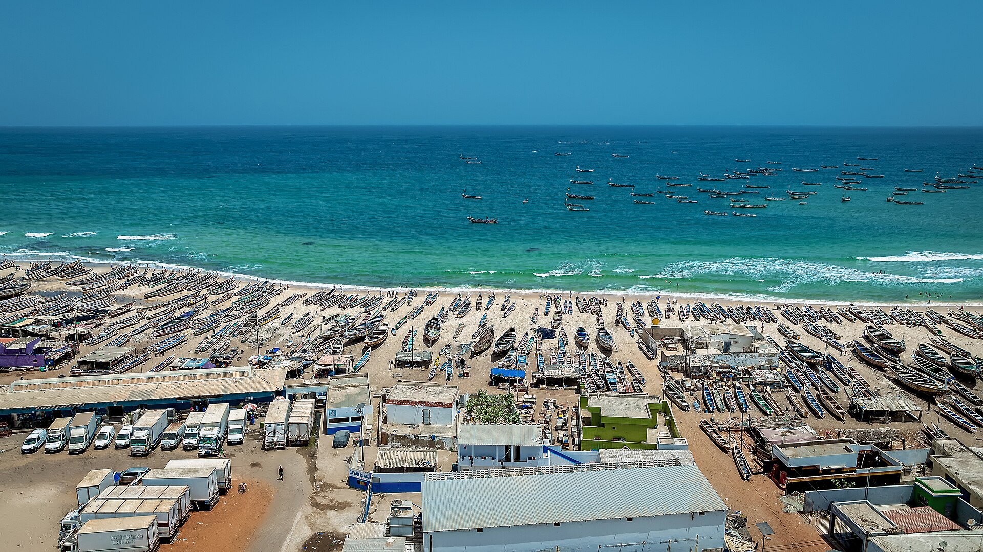 Fishing pirogues on the beach at Kayar, Senegal, seen from above