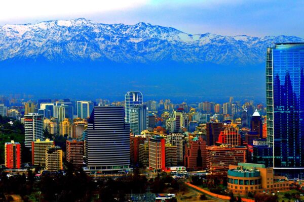 Skyline of Santiago, Chile, with glass towers in front of the snow-capped Andes.