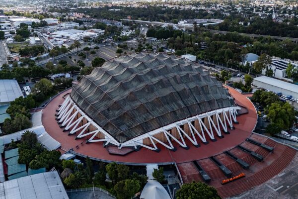 Aerial view of the copper-domed Palacio de los Deportes arena in Mexico City, where Soda Stereo plays on 23 November 2026