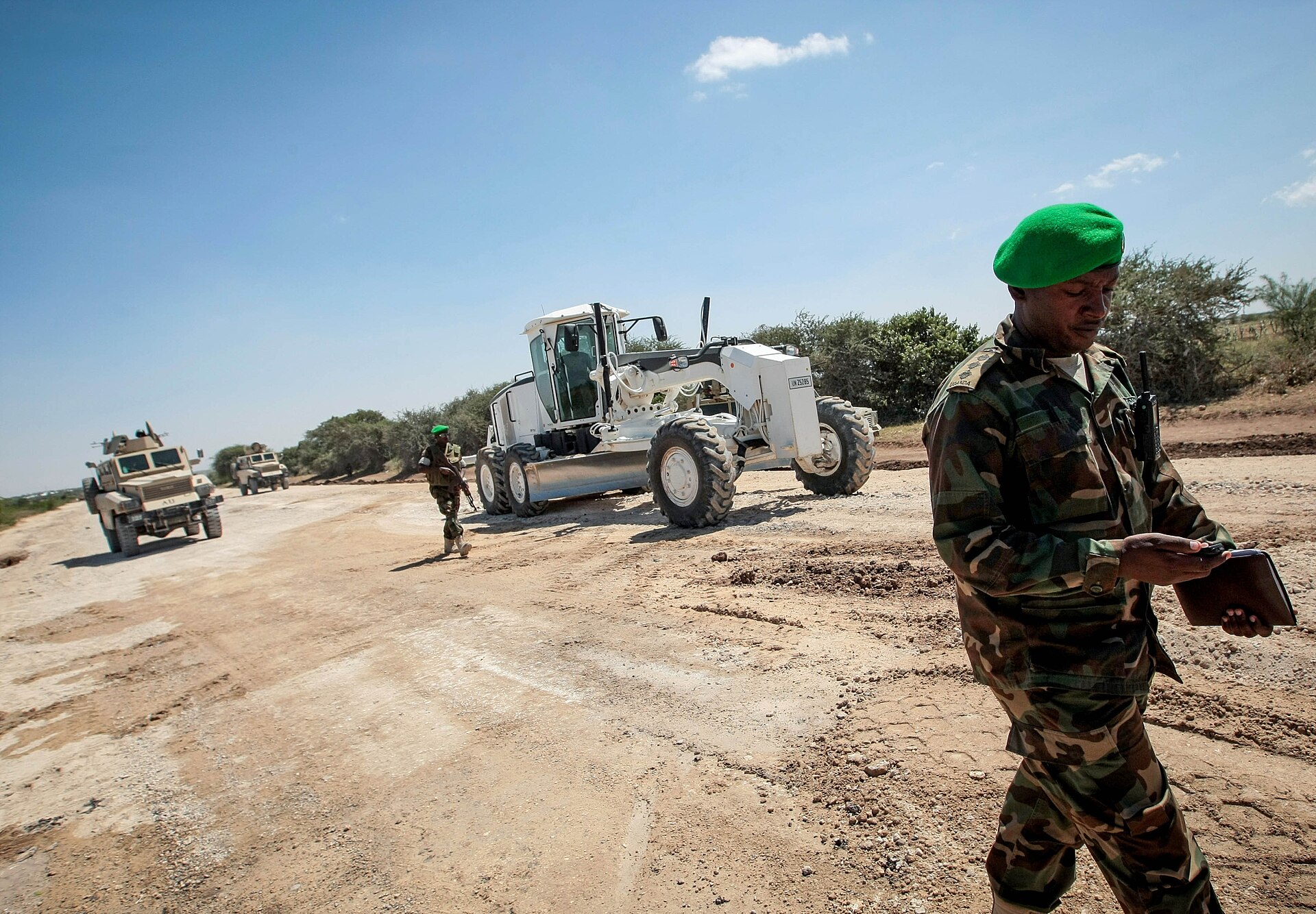 African Union troops and an armoured vehicle at road works on the Afgooye road in Somalia